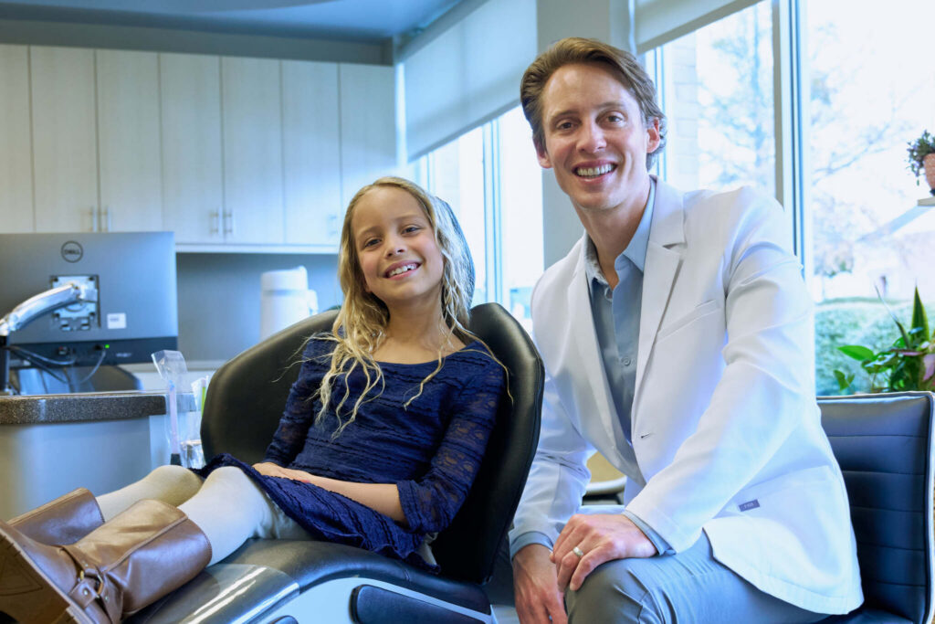 Dr Pittman With A Little Girl Patient