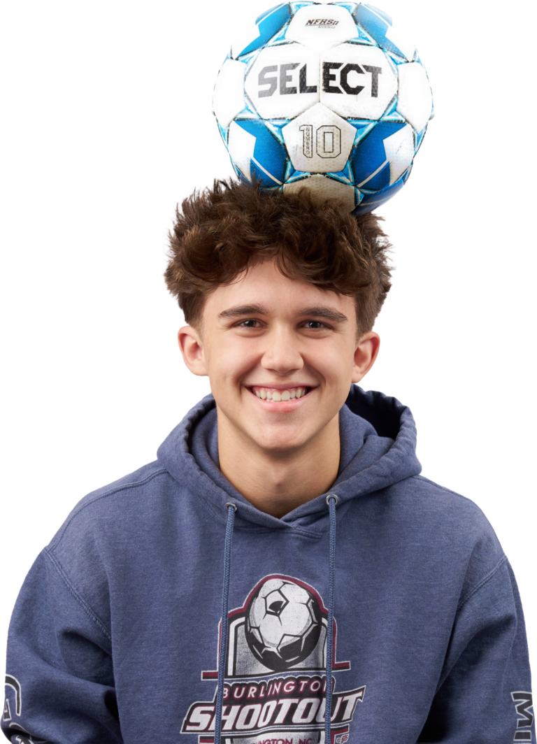 Teenage Boy With A Soccer Ball On His Head